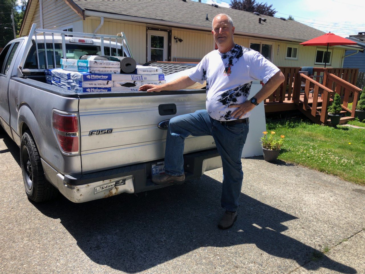 Robert standing next to his truck